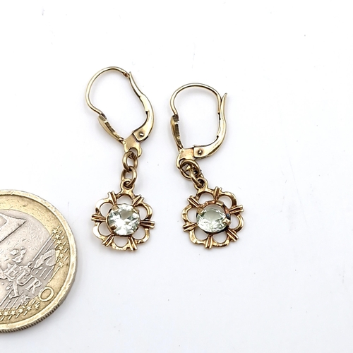 1002 - A dainty pair of vintage aqua marine gemstone floral pendant earrings set in nine carat gold. Stampe... 