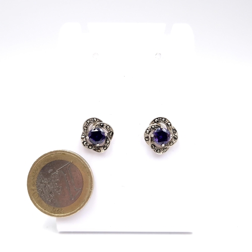 987 - A pair of sterling silver marcasite set stud earrings. Complete with 925 backs. Total weight - 3.24 ... 