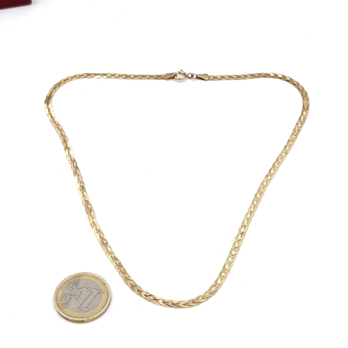 991 - Star Lot - A fabulous nine carat gold chocker necklace. Stamped 375. Total length of chain - 42cm. T... 