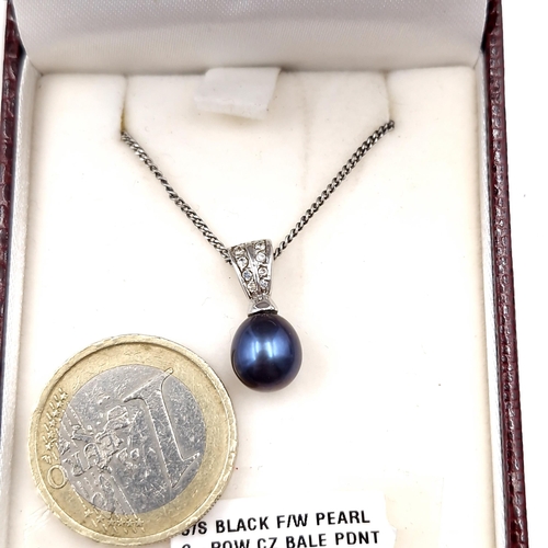 995 - A sterling silver black fresh water pearl and diamond pendant necklace. Total length of chain - 44cm... 