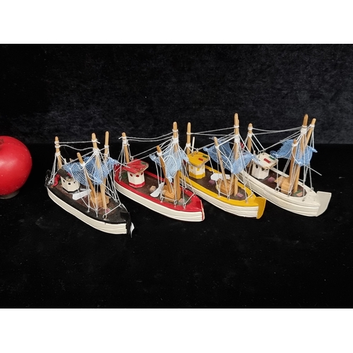 1177 - A selection of four nautical themed wooden fishing boats.
Previous in auction on 21.11.24 with Lot n... 