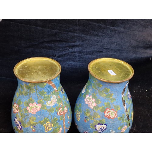 128 - A fine pair of large Chinese cloisonné enameled brass urn vases. They have a good side and the back ... 