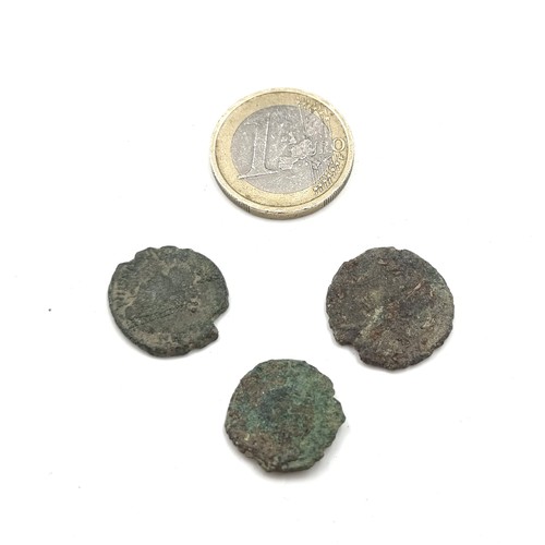 500 - Three Roman coins including one featuring the head of Constantius II (317 - 361). Good detail for th... 