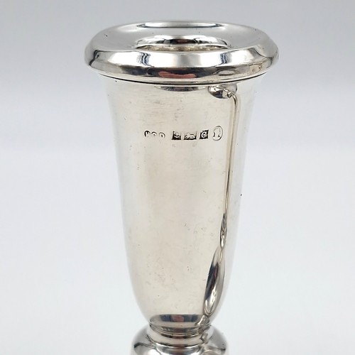 12 - A pair of sterling silver filled candle sticks hallmarked Birmingham with inscription ER 1953 (Coron... 