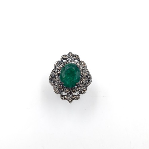 583 - Star Lot : An emerald stone ring set with diamond mount and set in sterling silver. Size - O. Weight... 