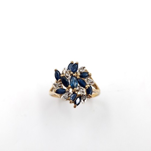 585 - Star Lot : An unusual large nine carat gold vintage sapphire & diamond ring. Size - N. Weight - 3.15... 