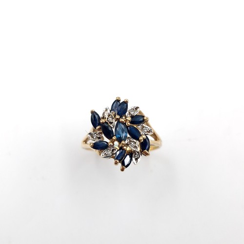 585 - Star Lot : An unusual large nine carat gold vintage sapphire & diamond ring. Size - N. Weight - 3.15... 