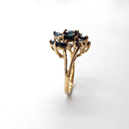 585 - Star Lot : An unusual large nine carat gold vintage sapphire & diamond ring. Size - N. Weight - 3.15... 