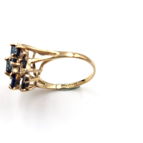 585 - Star Lot : An unusual large nine carat gold vintage sapphire & diamond ring. Size - N. Weight - 3.15... 