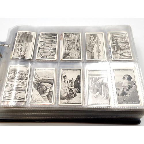 601 - A superb cigarette card album consisting of various subject matter. Includes sets of Downland, 'Figu... 