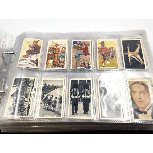 601 - A superb cigarette card album consisting of various subject matter. Includes sets of Downland, 'Figu... 