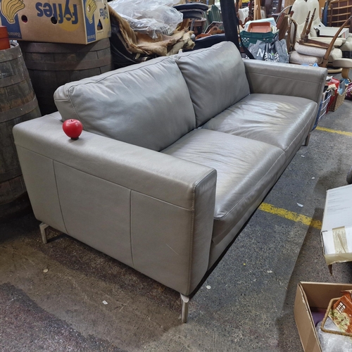 751 - Star Lot : A fabulous designer Natuzzi Contemporary gray leather sofa features plush upholstery and ... 