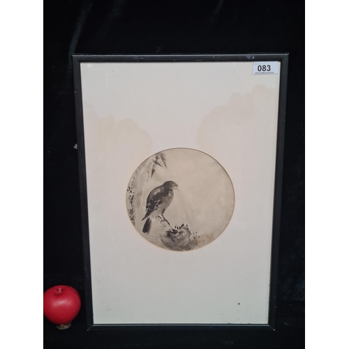 83 - A print after an original Japanese painting titled 'Bird on a Rock'. Housed in a black frame behind ... 