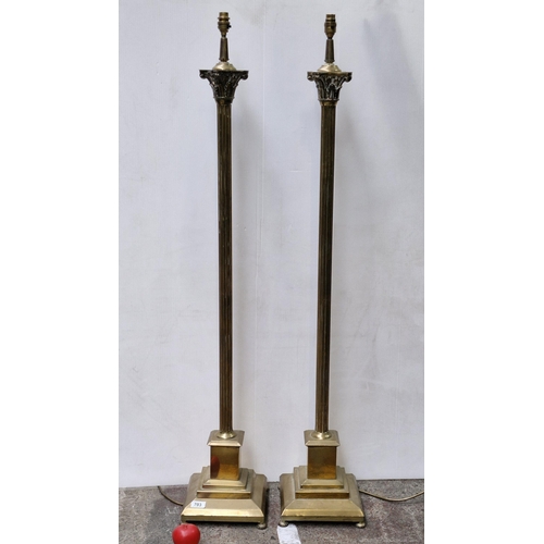 703 - Star Lot : A fabulous pair of very tall heavy brass table lamps with reeded Corinthian columns. Tall... 