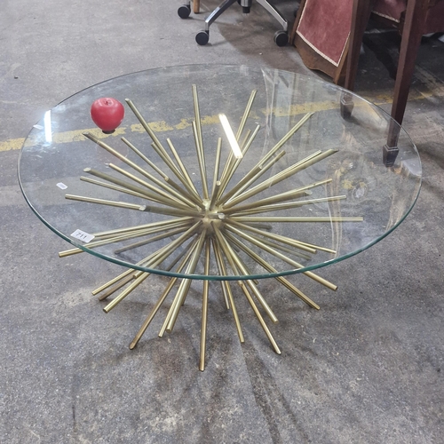 711 - Star Lot An Italian starburst coffee table with glass top and metal base. Really striking design. Fr... 