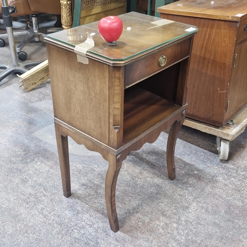 712 - A glass vintage topped mahogany bedside table / cabinet featuring pull out drawer.