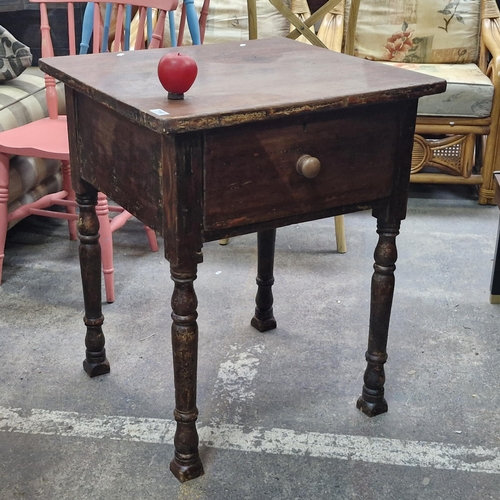 716 - A heavy rose wood bedside / side table with unusual feet.