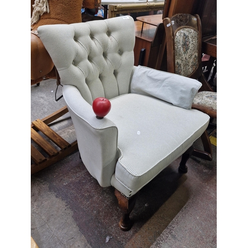 722 - Star Lot : A gorgeous antique Victorian armchair which has been newly upholstered in a very attracti... 