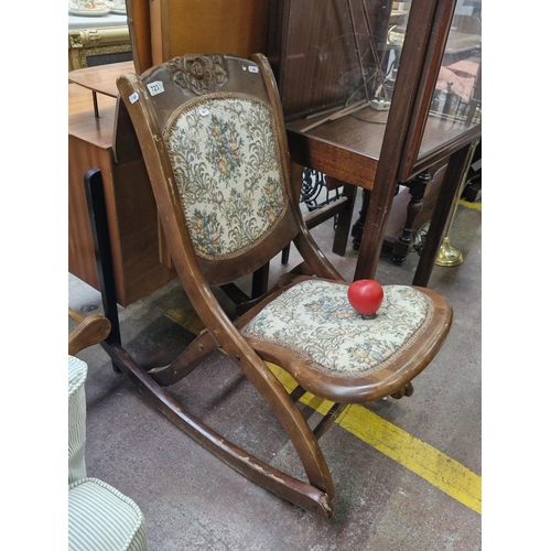 723 - An unusual Victorian style vintage wooden folding rocking chair. Features tapestry seat and back and... 