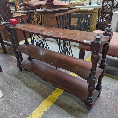 727 - An antique three tier open shelving unit / bookcase featuring serpentine front chest. Lovely quality... 