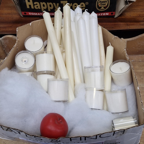 730 - A box containing a large collection of long church candles and malt tips.