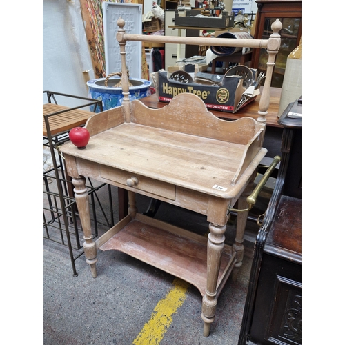 732 - Star Lot : A gorgeous Victorian pine wash stand with brass hand towel rail and shaped gallery back. ... 