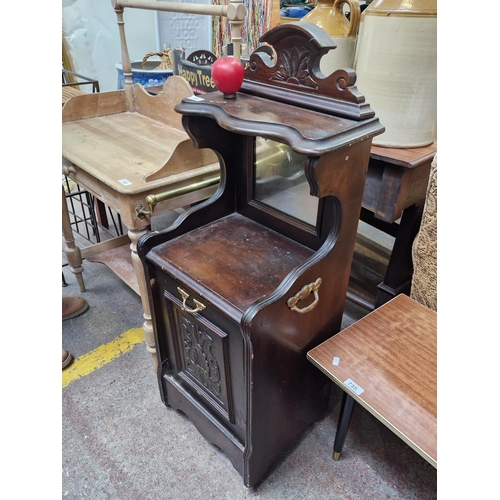 733 - An Edwardian Mahogany coal cabinet / purdonium featuring carved pullout cabinet and bevelled mirror ... 