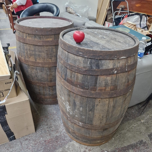 745 - A pair of large, very heavy oak whiskey full sized Barrels with metal binding. Dimensions: 90cm heig... 