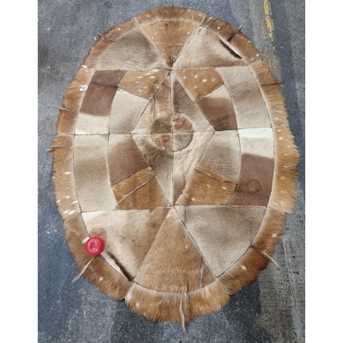 749 - Star Lot : A Super oval 1920s South African Antelope hide rug brought back to Ireland before the war... 