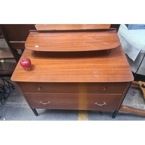 699 - Star Lot : Mid-Century Modern teak vanity with two drawers, elevated shelf, and large mirror. Featur... 