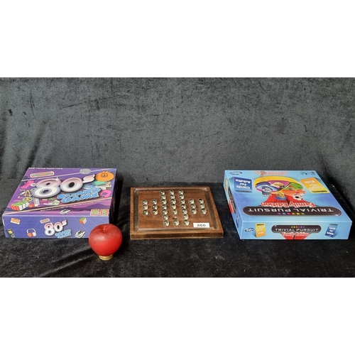 1396 - Three fun games. Includes a trivial pursuit family edition, 'Awesome' 80's board game and a set of m... 