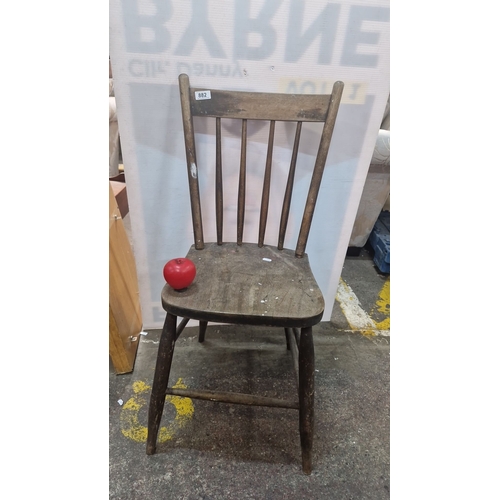 1400 - Rustic wooden chair, from the early 20th century, featuring turned spindle backrest and simple taper... 