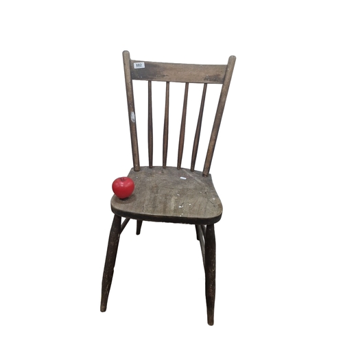 1400 - Rustic wooden chair, from the early 20th century, featuring turned spindle backrest and simple taper... 