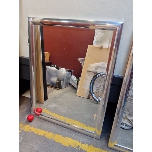 1403 - Large rectangular mirror with a sleek silver frame. Sturdy backing for secure mounting from the Gres... 