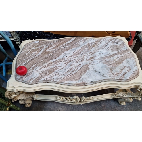 1410 - Star Lot : A French chateau Carved wood coffee table, featuring a cold Italian  marble top with orna... 