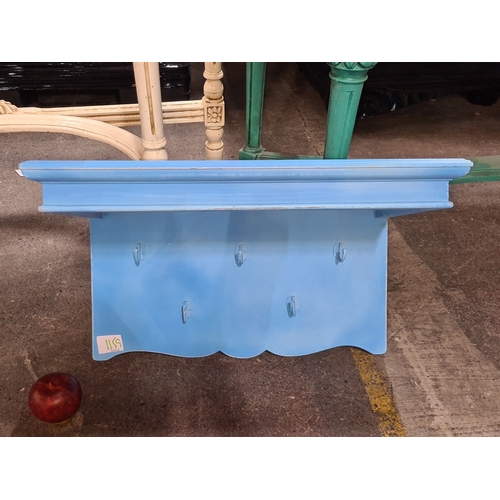 1440 - Vintage blue wooden wall shelf with key / coat  hooks, scalloped edge, and a distressed finish.
Prev... 