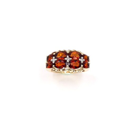 2 - Star Lot : A very impressive nine carat gold multi stone garnet ring. Size - M 1/2. Weight - 3.43 gr... 