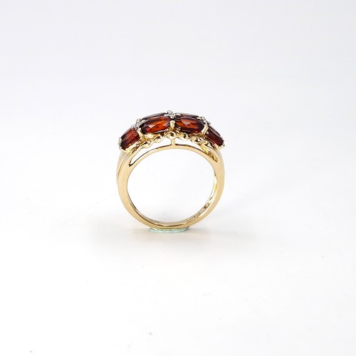 2 - Star Lot : A very impressive nine carat gold multi stone garnet ring. Size - M 1/2. Weight - 3.43 gr... 