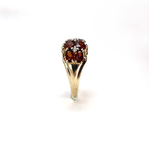 2 - Star Lot : A very impressive nine carat gold multi stone garnet ring. Size - M 1/2. Weight - 3.43 gr... 