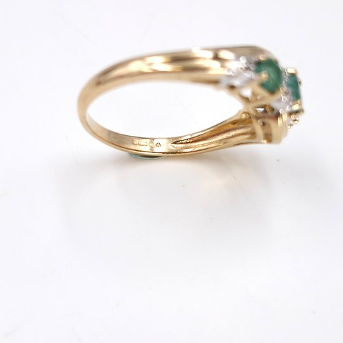 10 - Star Lot : A fabulous vintage  nine carat gold emerald and diamond twist mounted ring. Size - O. Wei... 