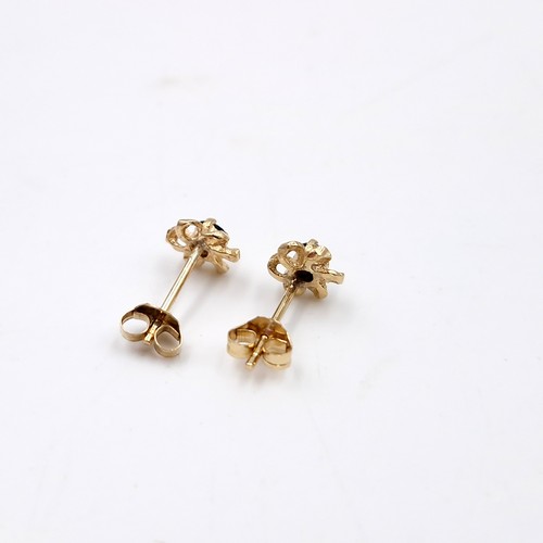 3 - A pair of sapphire nine carat gold stud earrings. Weight - 0.5 grams.