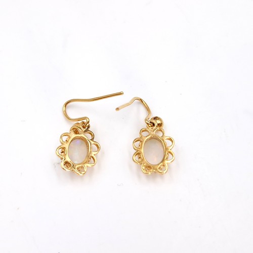 12 - A pair of nine carat gold fire opal earrings - suitable for pierced ears. Weight - 1.14 grams. Lots ... 