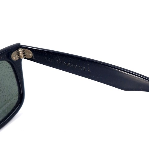 30 - A pair of black original  Ray-Ban USA sunglasses. Together with Wayfarer pouch.