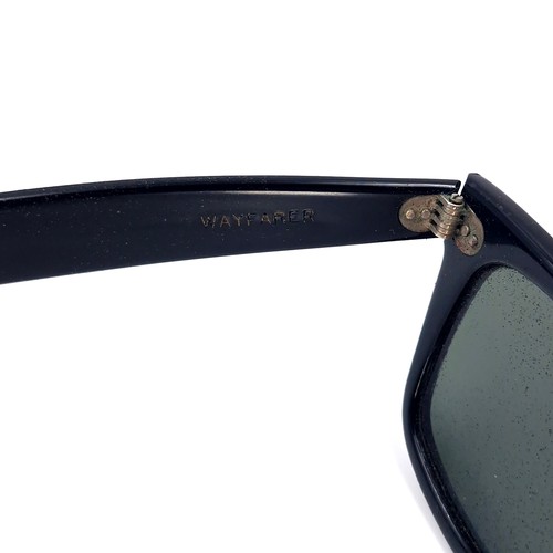 30 - A pair of black original  Ray-Ban USA sunglasses. Together with Wayfarer pouch.