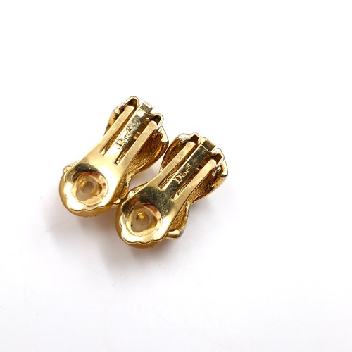 51 - Star Lot: A very nice pair of designer Dior gold metal twist set clasp earrings. Weight - 18 grams. ... 