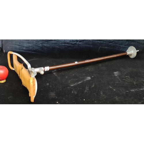 102 - A vintage shooting stick with fold out leather seat made by Mills Ltd., Birmingham.