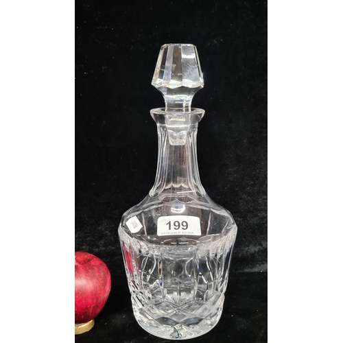 199 - A quality cut crystal decanter with original stopper. In good condition.