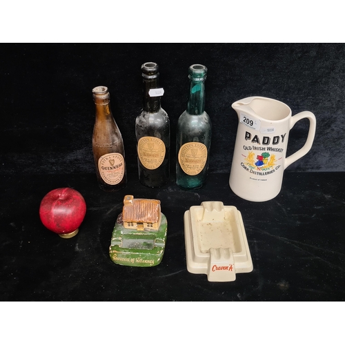 209 - Six pieces of breweriana including a Paddy's Whiskey jug, a Craven A ashtray and three vintage Guinn... 