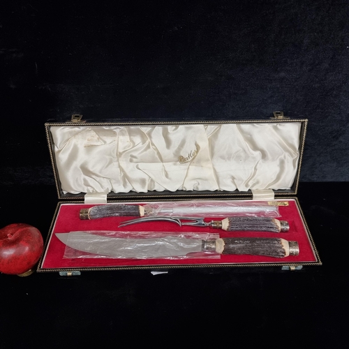217 - A three piece George Butler of Sheffield carving set with genuine stag horn handles. Housed in origi... 