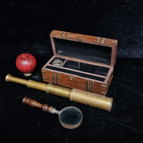 222 - A vintage style brass telescope, compass and magnifying set in a wooden nautical themed case.
